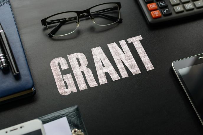 Grants written on table