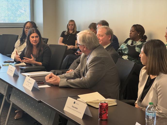 Photo of Cristina Killingsworth (left) confers with members of the SC Nexus for Advanced Resilient Energy, a project supported through EDA’s Tech Hubs program.